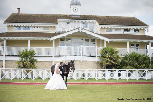 Bride and Groom with a horse outside Dallas burston
