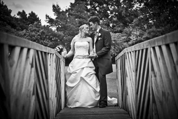 Married couple on a wooden bridge at Lea Marston Hotel