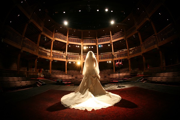 Bride stood on the stage at Royal Shakespeare Theatre