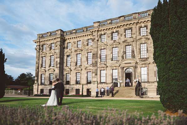 Bride and Groom stood in the gardens of Stoneleigh Abbey