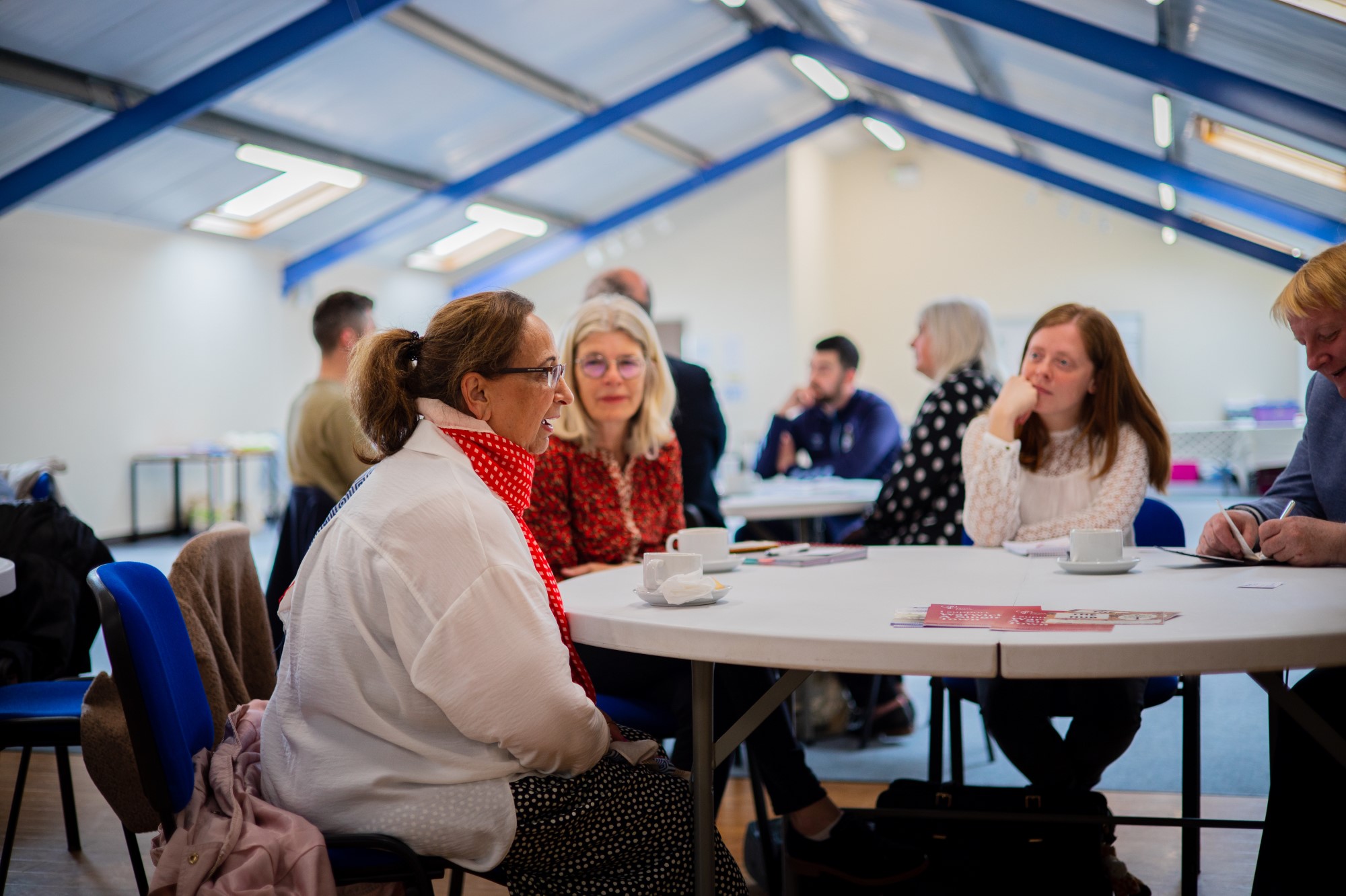 Representatives from local community groups discussing mental wellbeing
