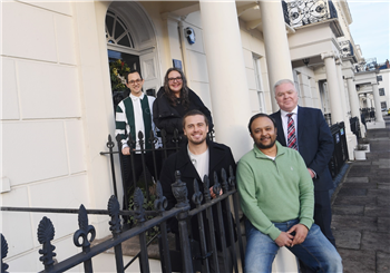 members of the business Yellow Panther outside a building with Councillor Martin Watson