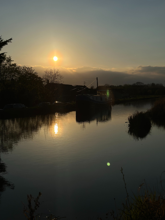 A sunset over a canal