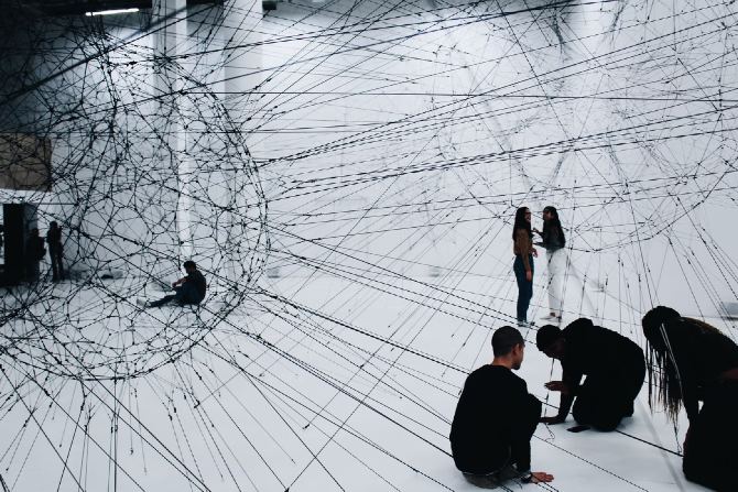 Group of people sitting on the floor