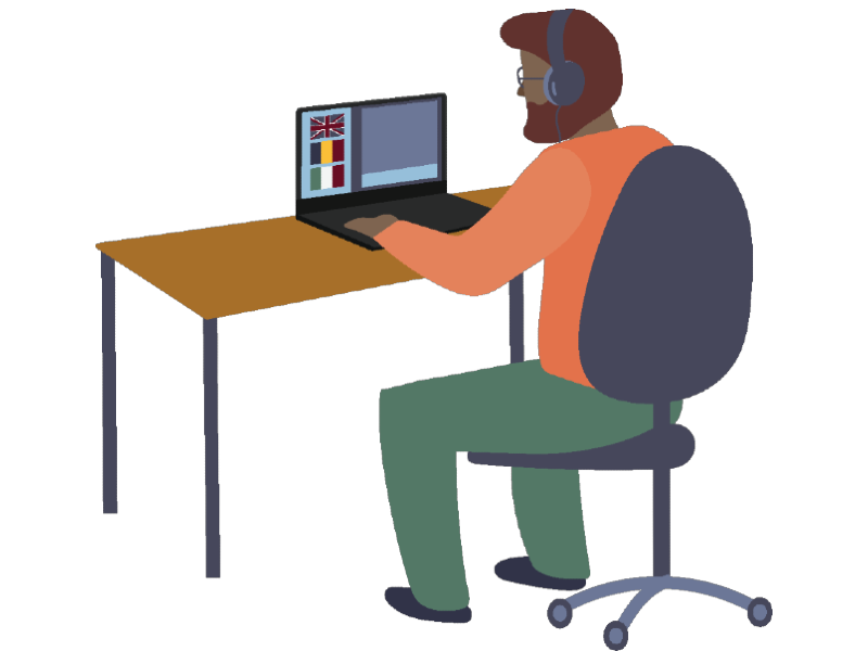 Man sitting at a desk looking at a computer