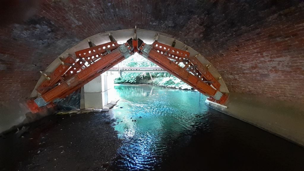 Heavy duty propping beneath the arches of Baginton Mill bridge make sure they remain safe while stones are replaced.