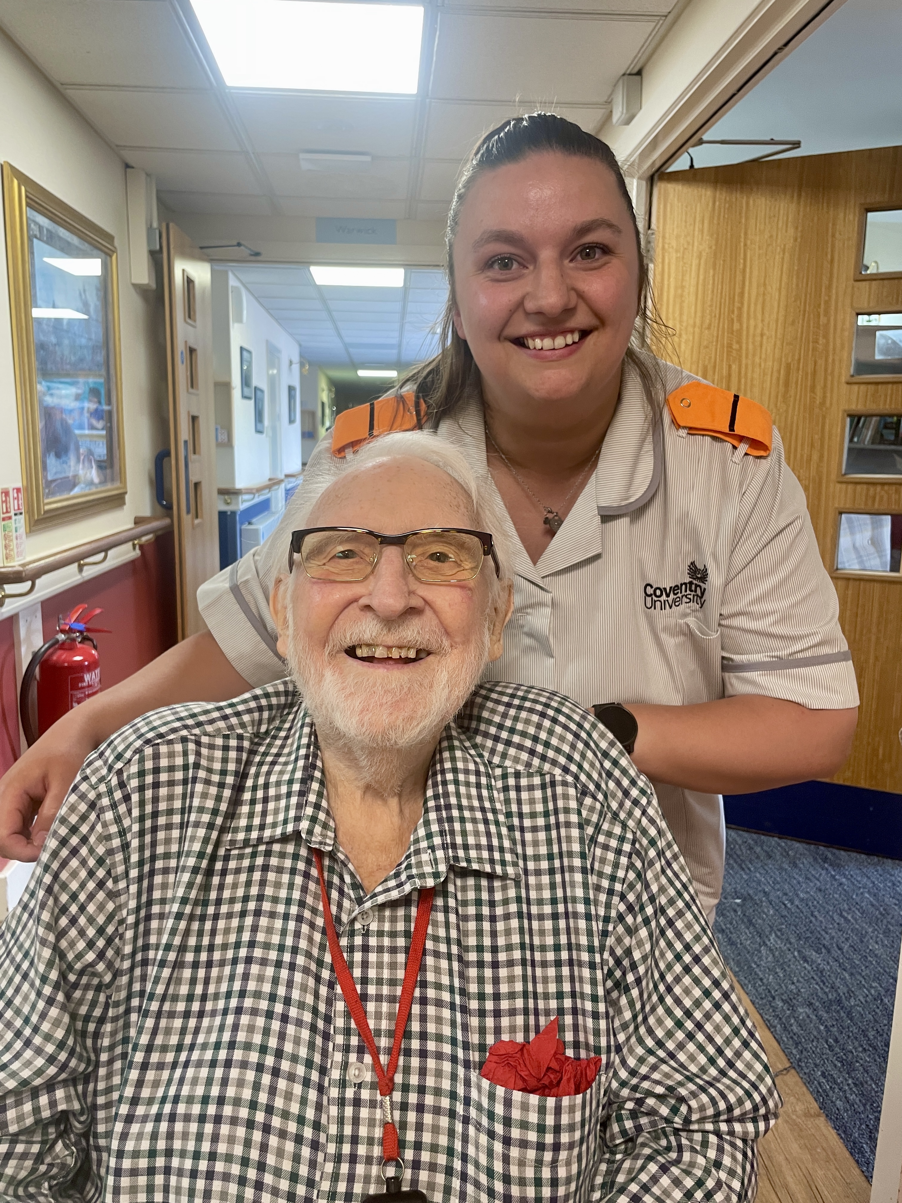 a photo of nurse associate, Bethan with a resident at Galanos House