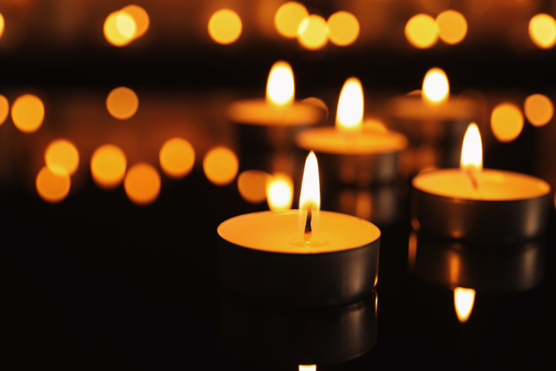 Candles sat on a dark surface