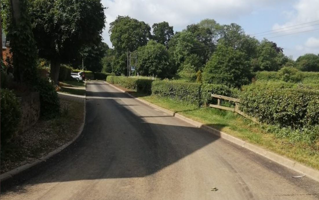 Completed surface dressing on a road surface in the countryside.
