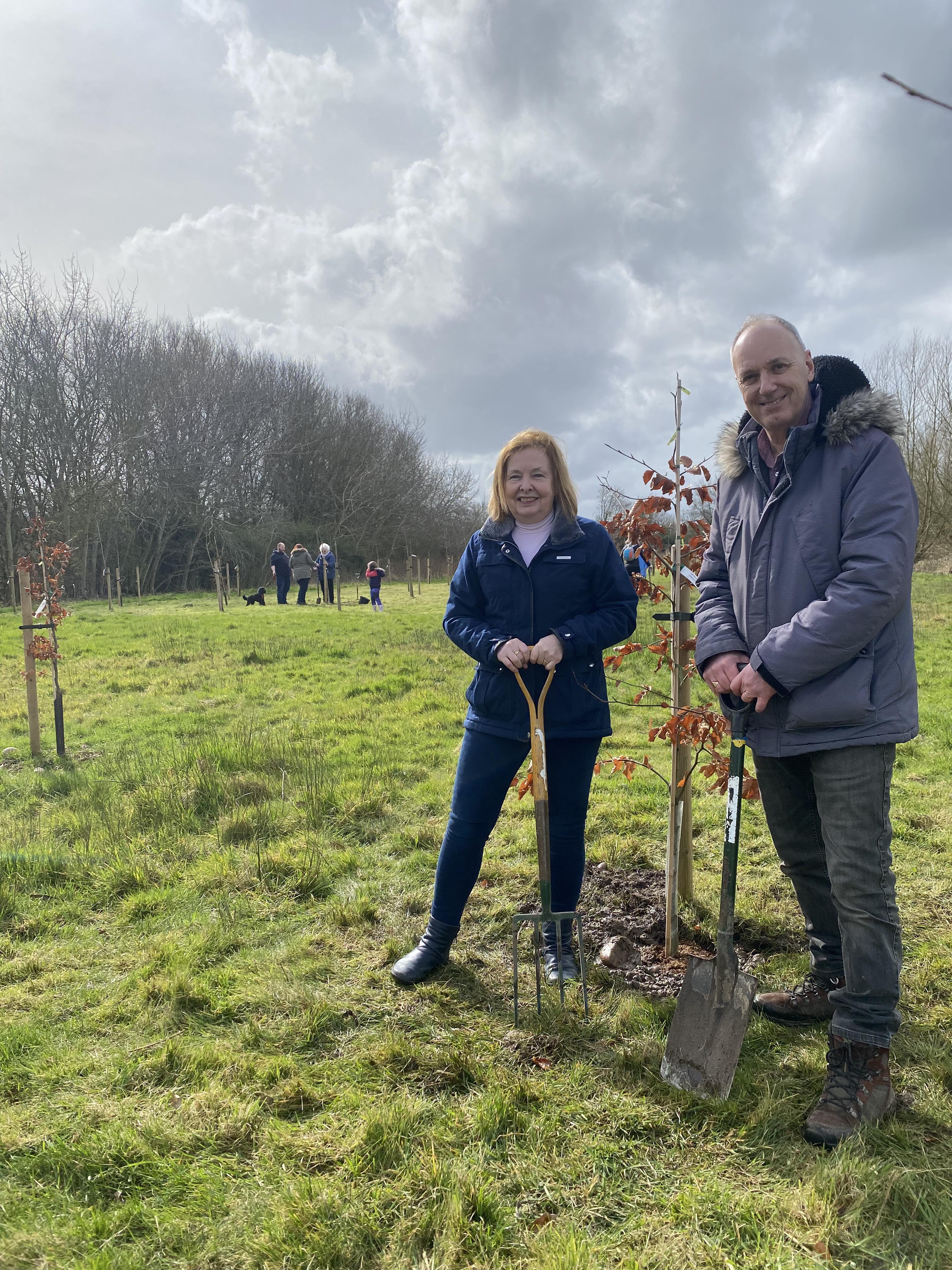Cllr Heather Timms and Cllr Andy Jenns of Warwickshire County Council stand by a newly planted tree