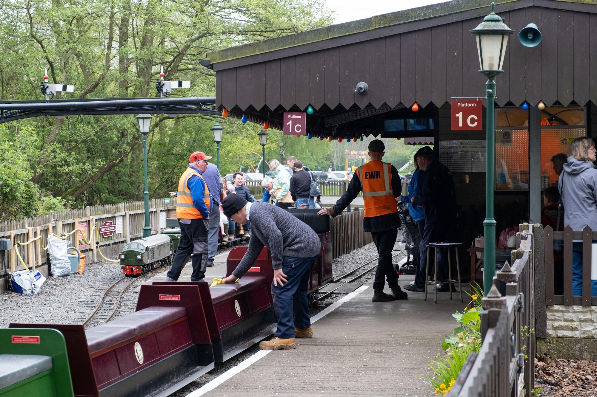 Photograph of the main station on the Echills Wood Railway, including train staff and members of the public.