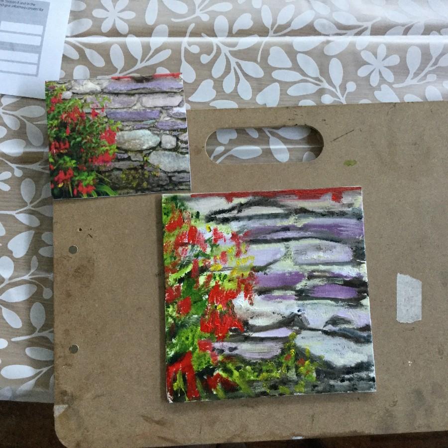 painting of a grey rocky wall with red flowers and green leaves on the left side of the wall.