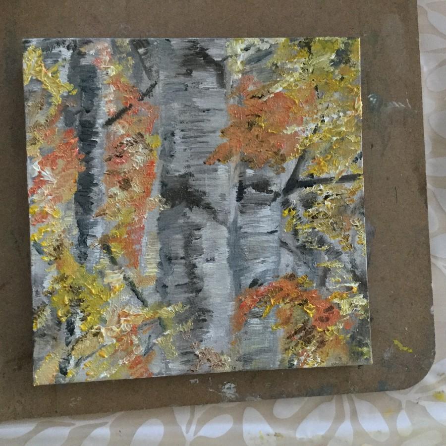 painting of grey tree trunks with red, orange and yellow leaves on the tree branches.