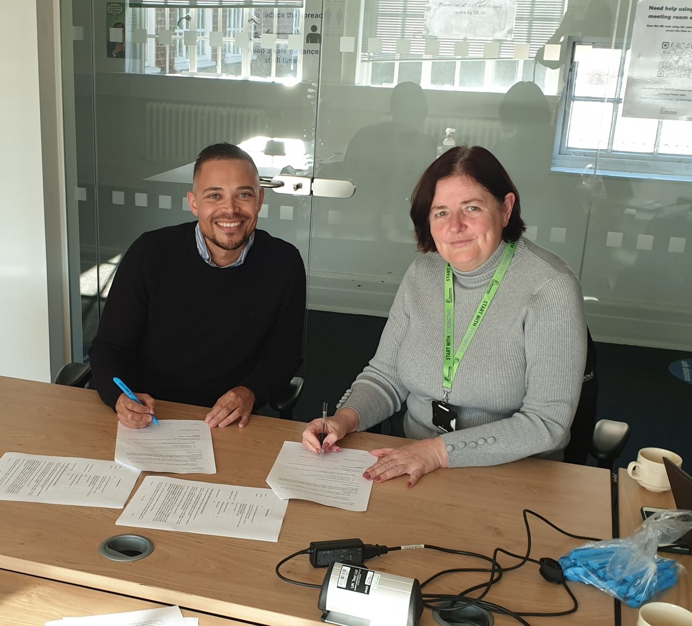 Steven Russell, Founder of Elements and Sharon Shaw, Service Manager - Corporate Parenting at Warwickshire County Council signing the contract