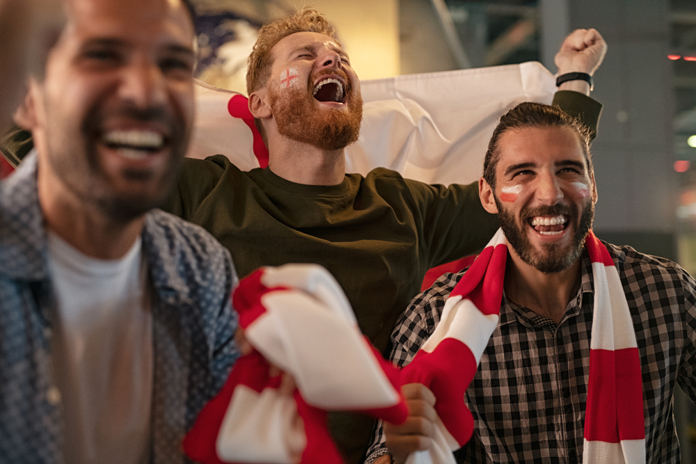 England football fans watching a match together