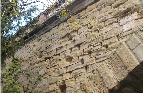 Missing and heavily eroded masonry to the bridge elevation