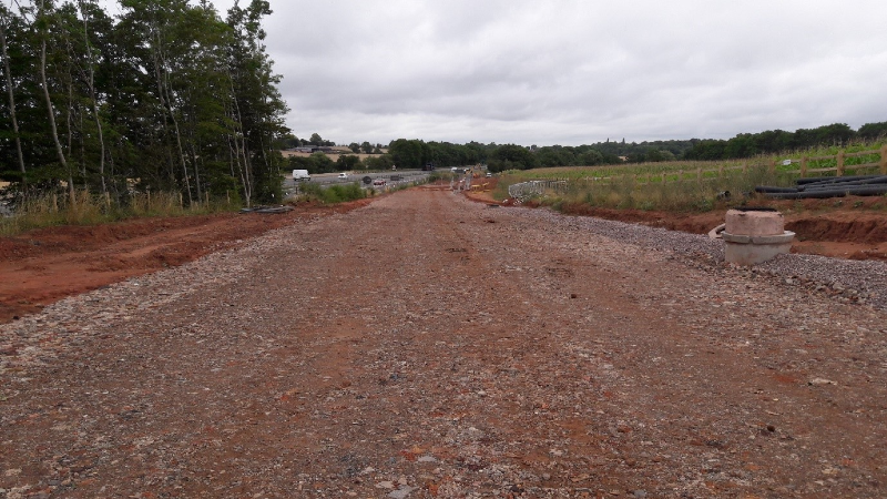 Depicting the completed work of laying the capping layer of aggregate to provide a stabilised surface to begin creating the road surface