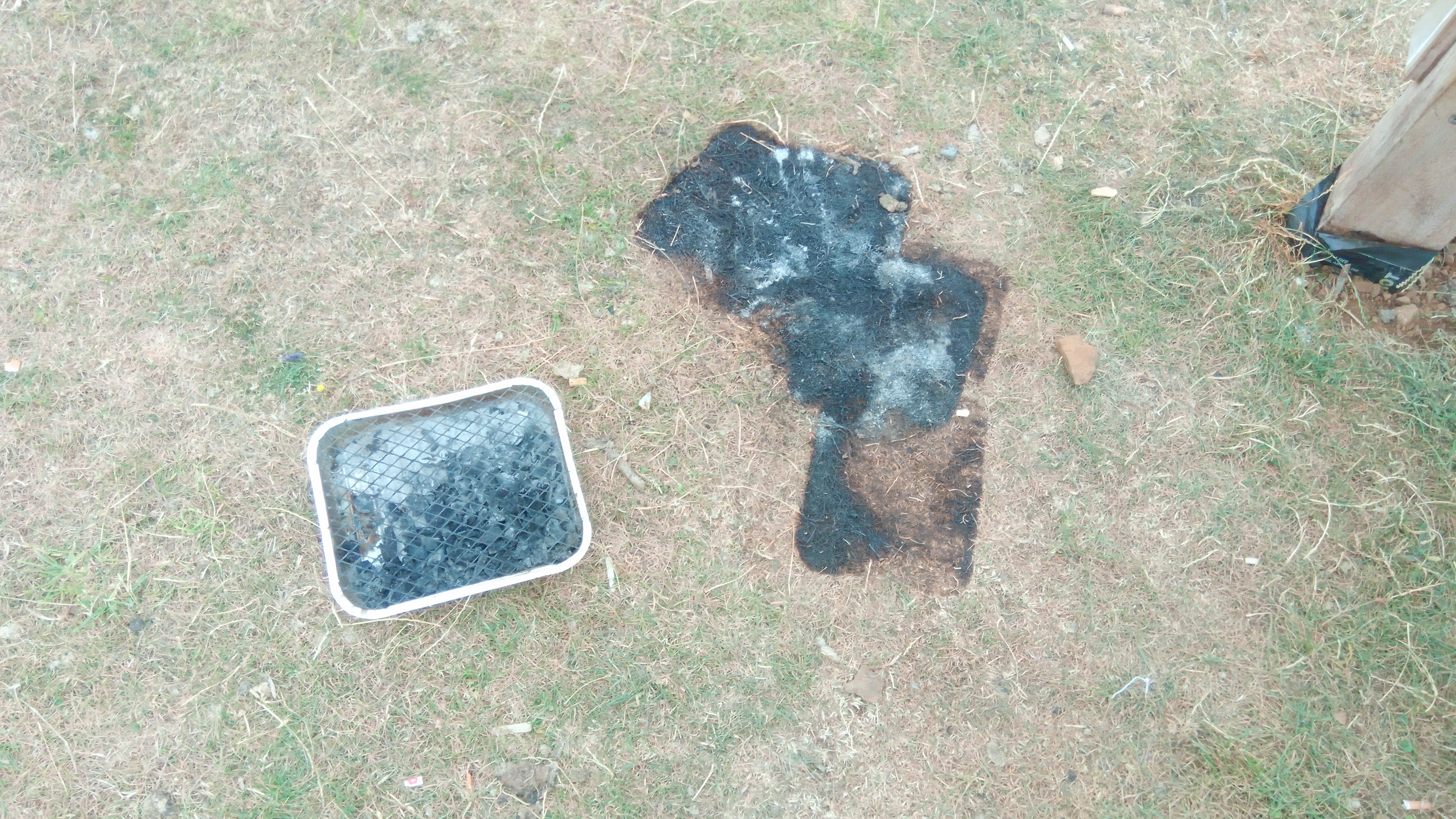 A photograph of a bbq, discarded at Burton Dassett Hills Country Park, causing damage to the grass.
