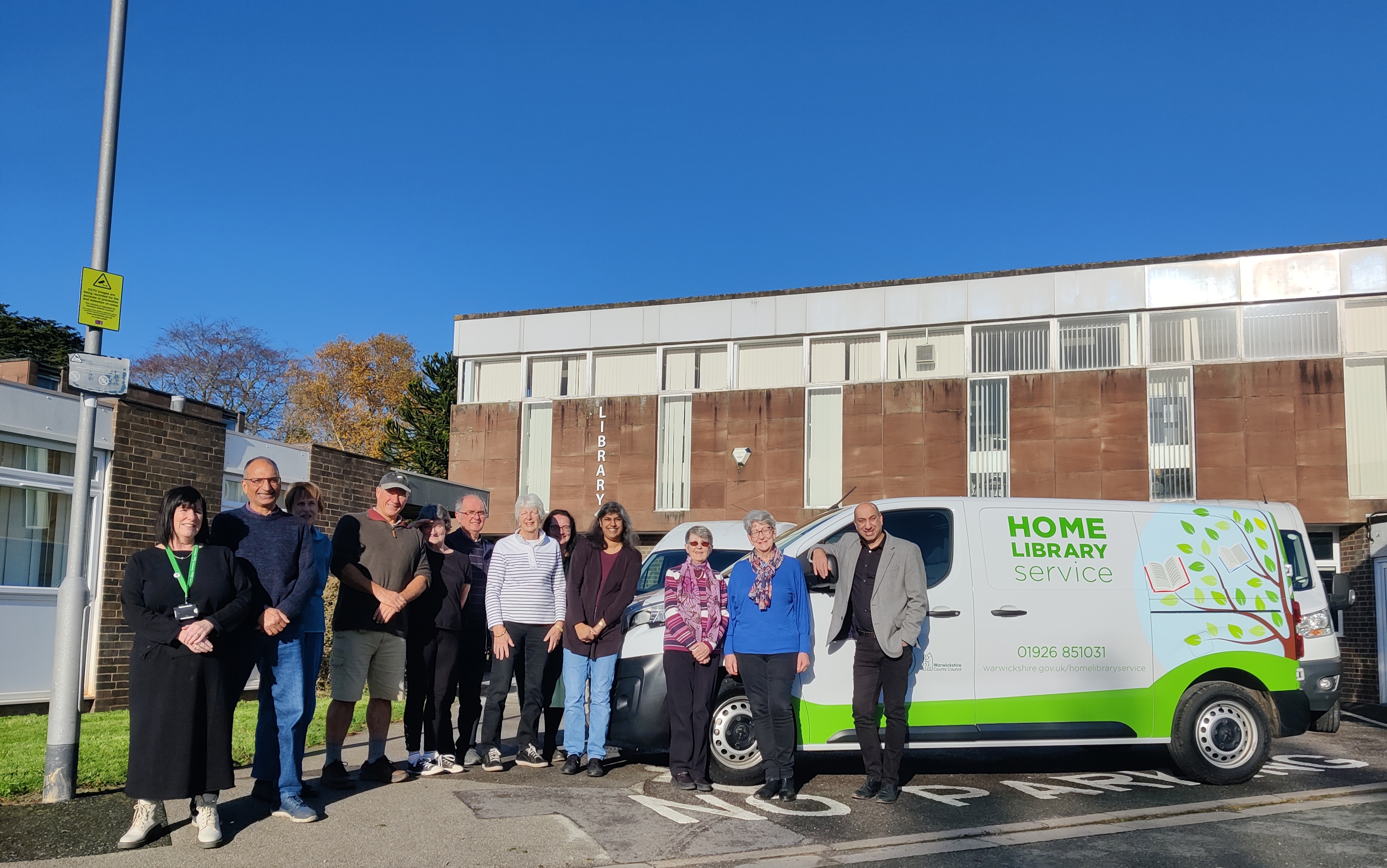 Volunteers and Ayub Khan (right), Head of Libraries and Face to Face front-line services at Warwickshire County Council, with the new van outside of Kenilworth Library.