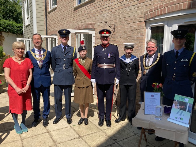 The Lord Lieutenant, Tim Cox, presents one of Warwickshire’s last Queen’s Awards for Voluntary Service to Jill Fraser, CEO of Kissing it Better.