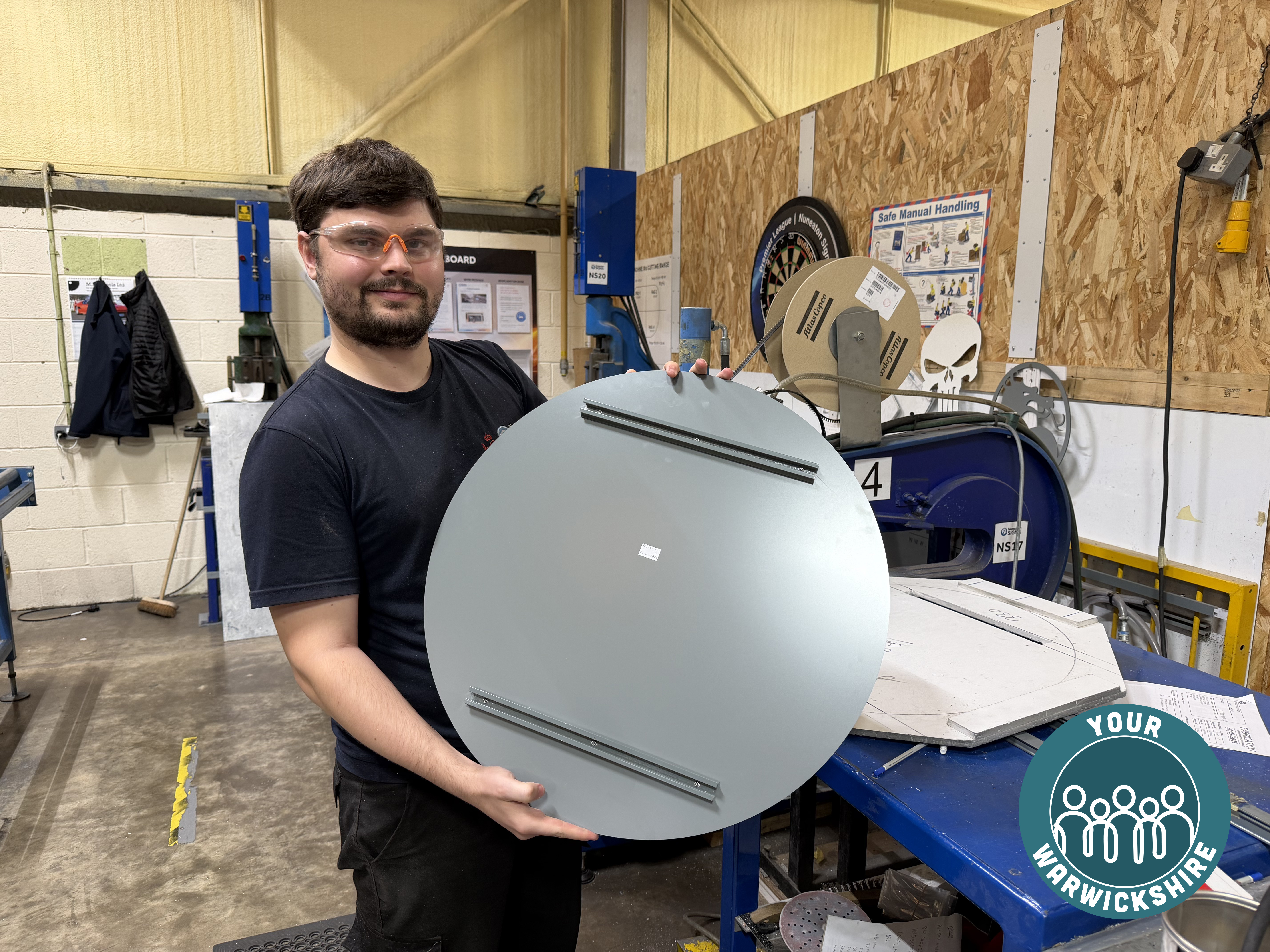 Dan with some of his metal plate work at Nuneaton Signs.