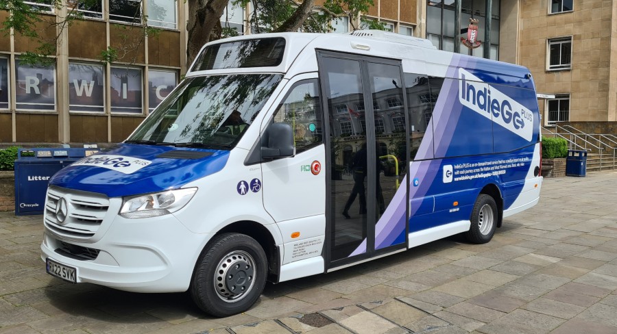 A photo of the new Indiego Plus vehicle in front of Warwickshire County Council.