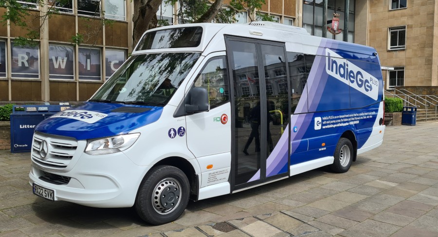 A photo of the new IndieGo Plus vehicle in front of Warwickshire County Council.