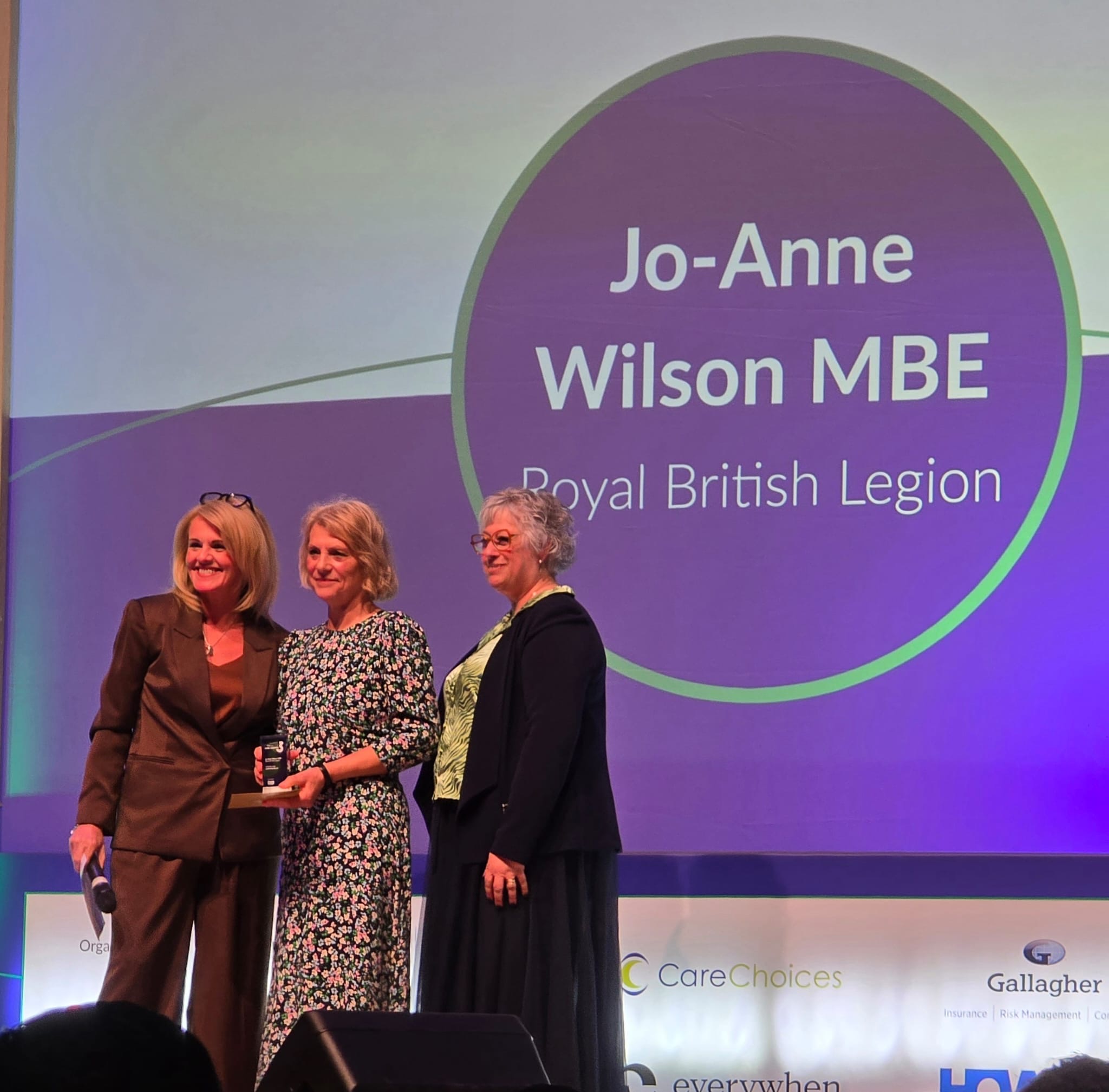 Photo of manager at Galanos House, J-Anne Wilson, receiving an award