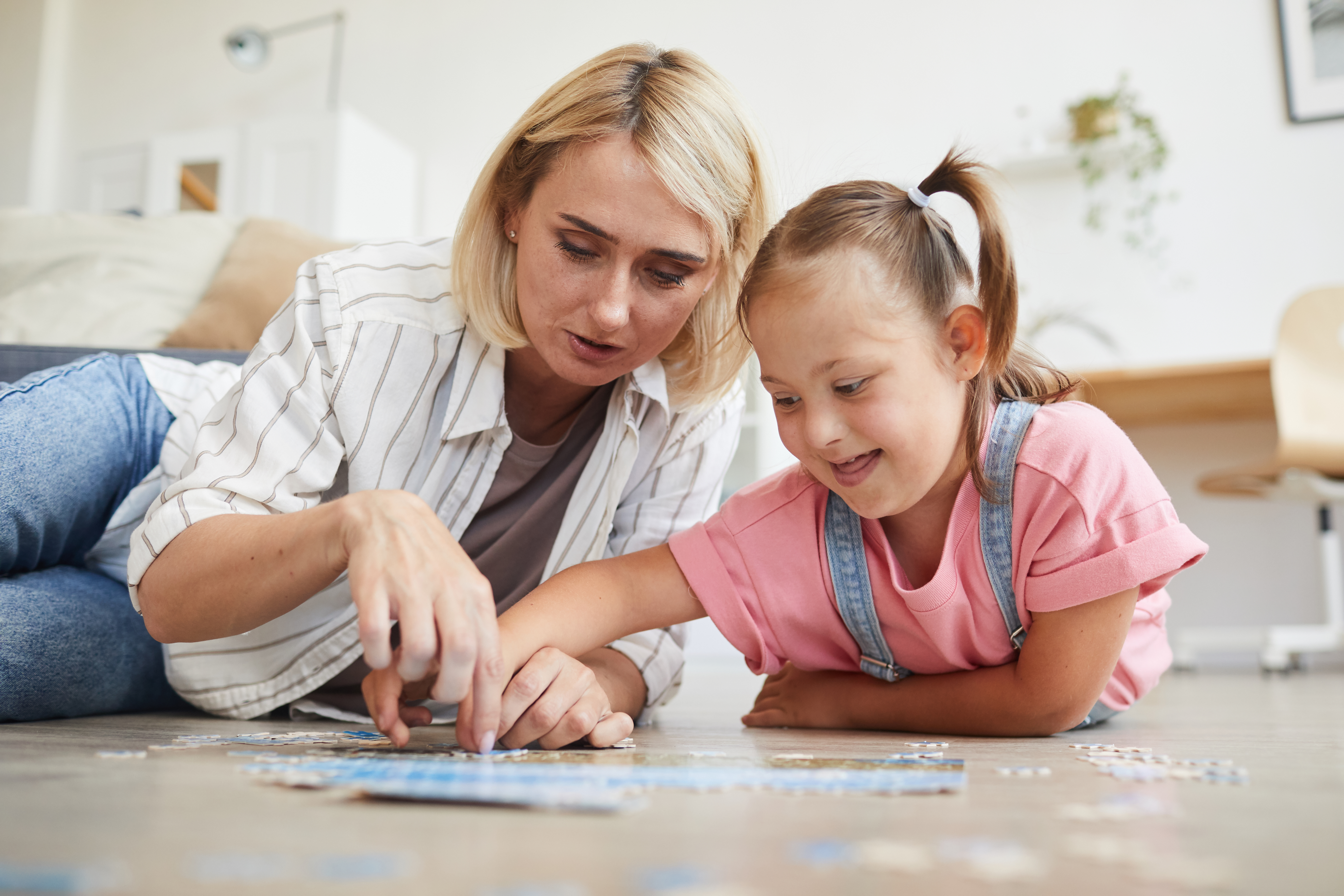 Mother playing with child with disability