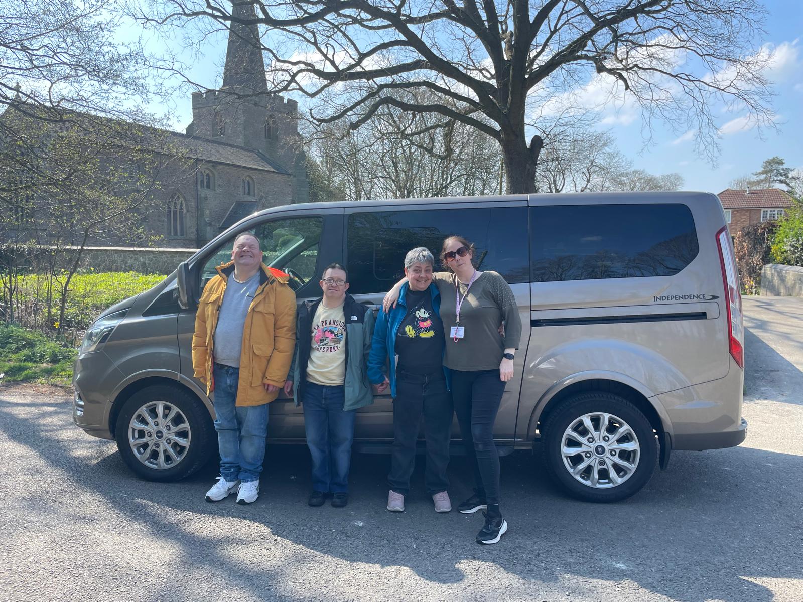 Users of New Directions Rugby stans in front of the new minibus