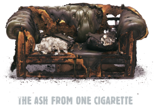 A burnt sofa from a cigarette ash fire.