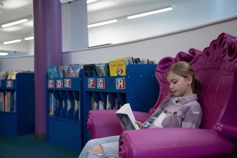 Child reading at rugby library