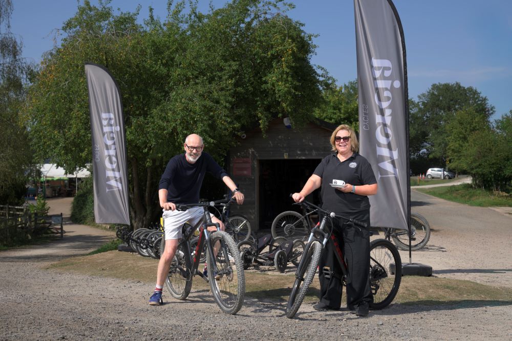Nicola and Roger on bikes outside Mercia Cycles