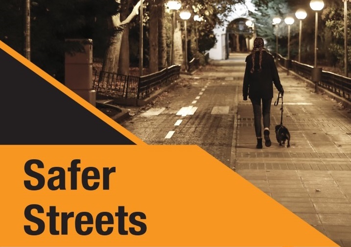Image of street lit by streetlights with words 'Safer Streets'