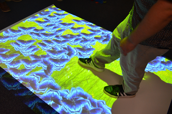 Person interacting with the sensory floor mat at Stratford-upon-Avon Library