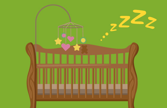 An image of a crib with a baby sleeping