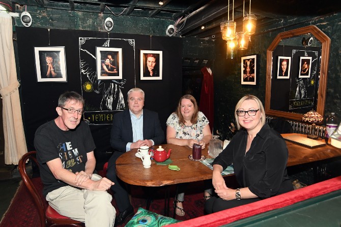 Four people sitting at a table in Temperance Cafe