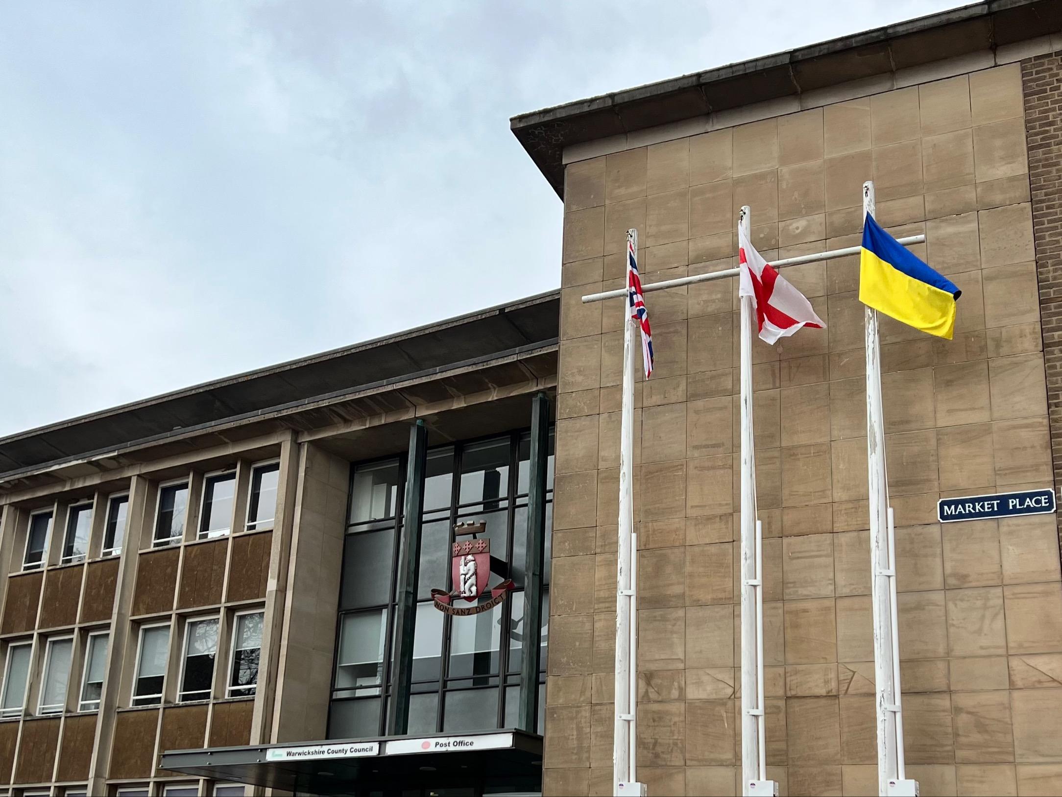 The Ukrainian flag, flying next to the Union Jack and St. George's Flag, at Shire Hall, the headquarters of Warwickshire County Council