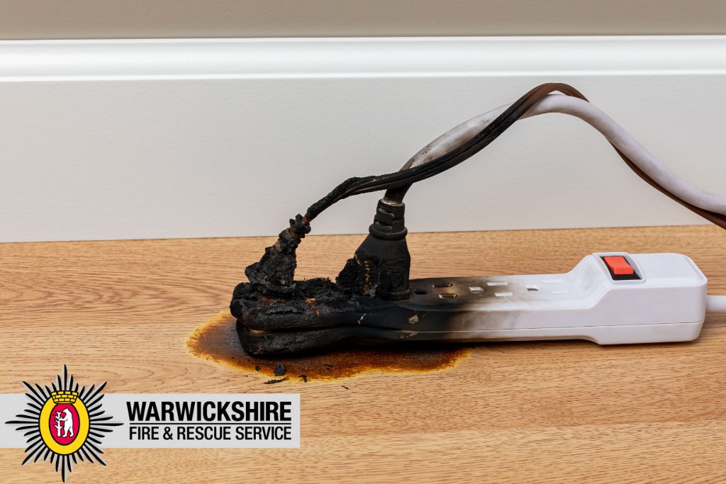 2 plugs in an extention lead which have been burnt due to electrical fire