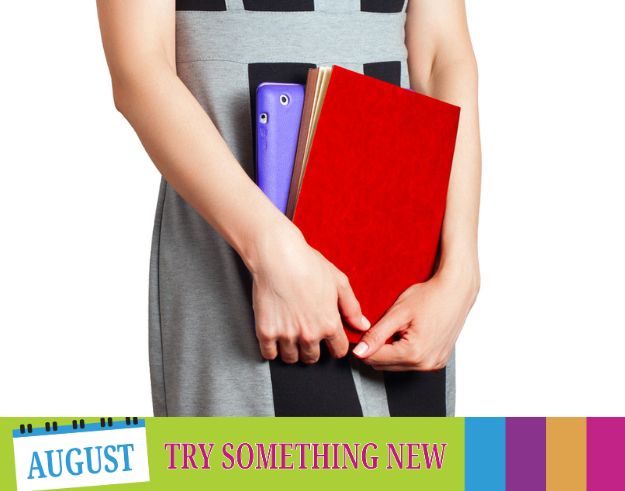 A photo of someone holding notebooks