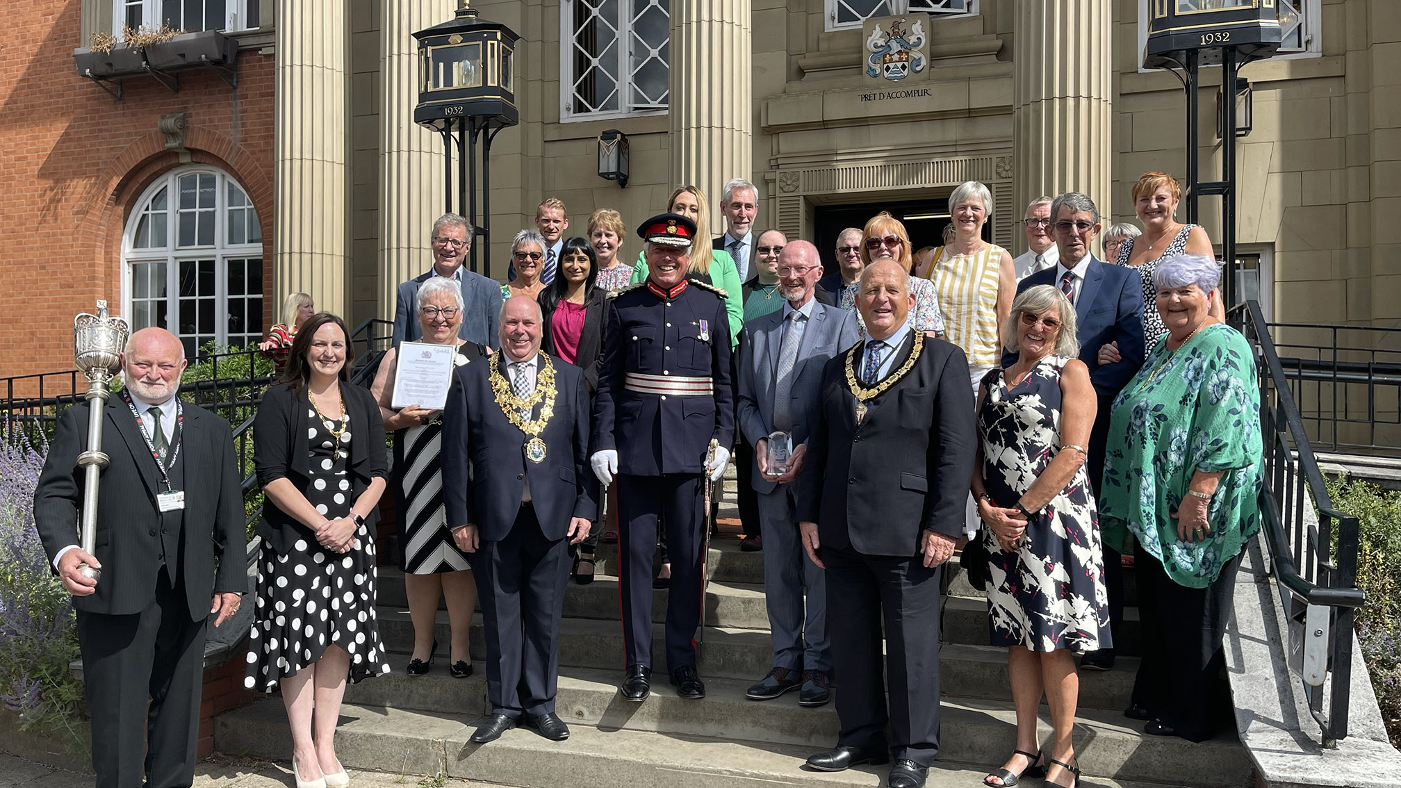 Lord Lieutenant Tim Cox presenting an Award to Volunteer Friends in August 2022.