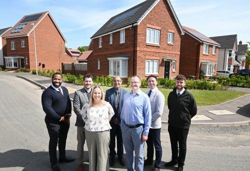 People standing on street in housing development
