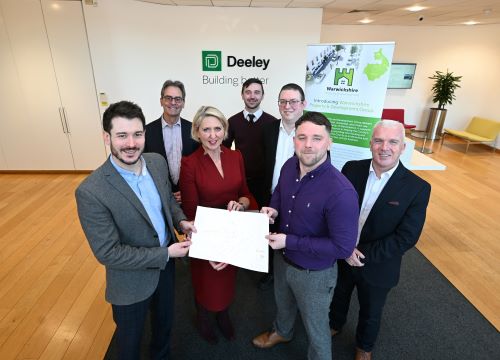 Group of people holding plan