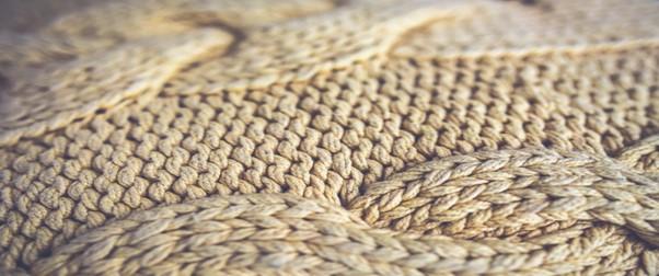 A cream-coloured woolly jumper.