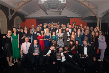 A group of people posing with an award at the 2023 West Midlands Tourism Awards