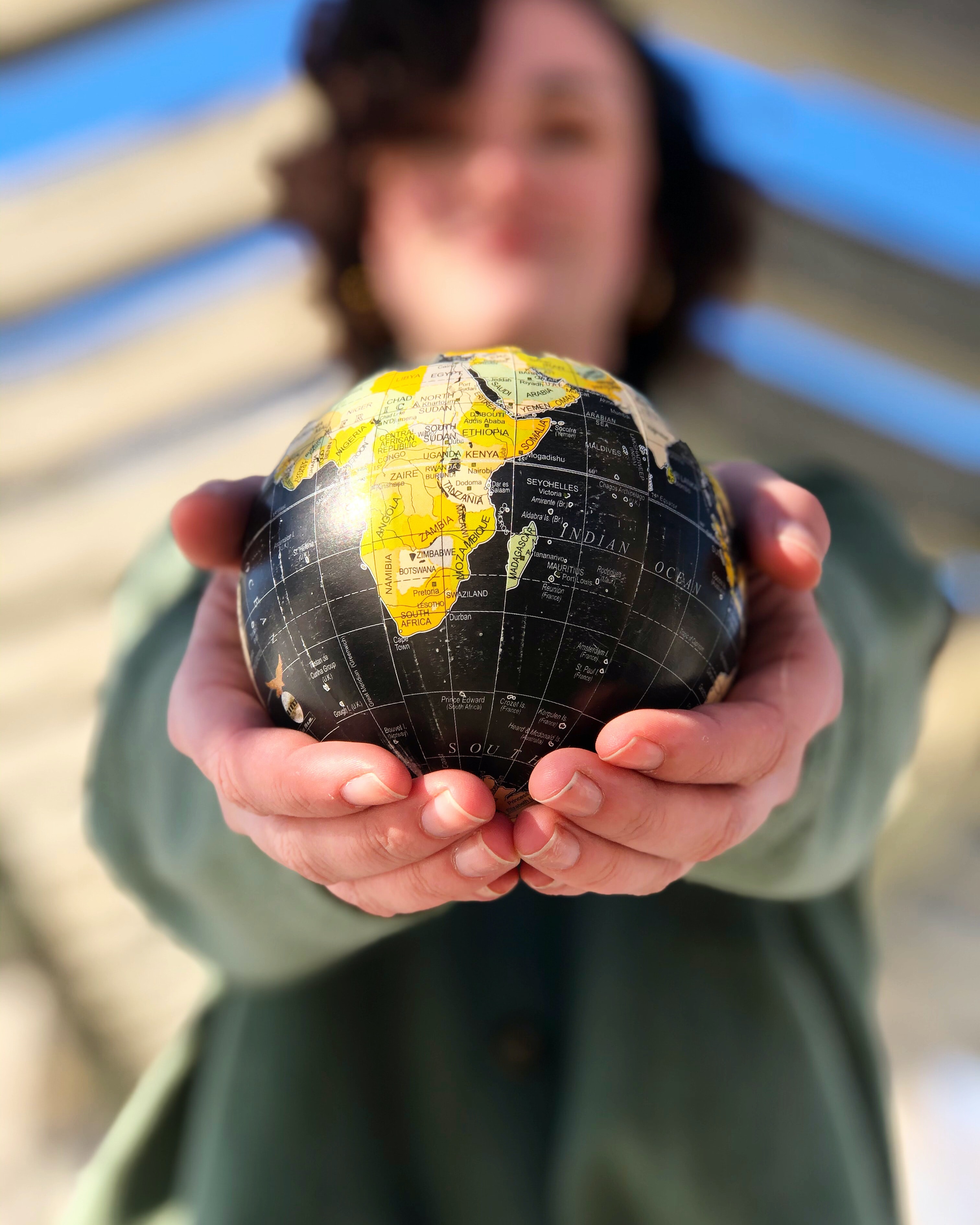 Globe held in woman's hands