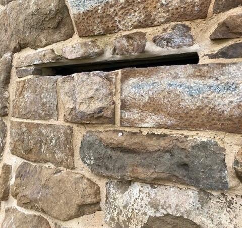 Bat slot installed above the doorway.