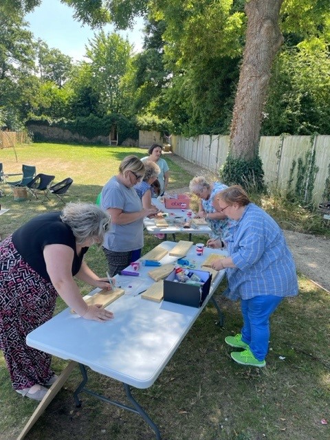 Participants taking part in crafts at Cohort 4