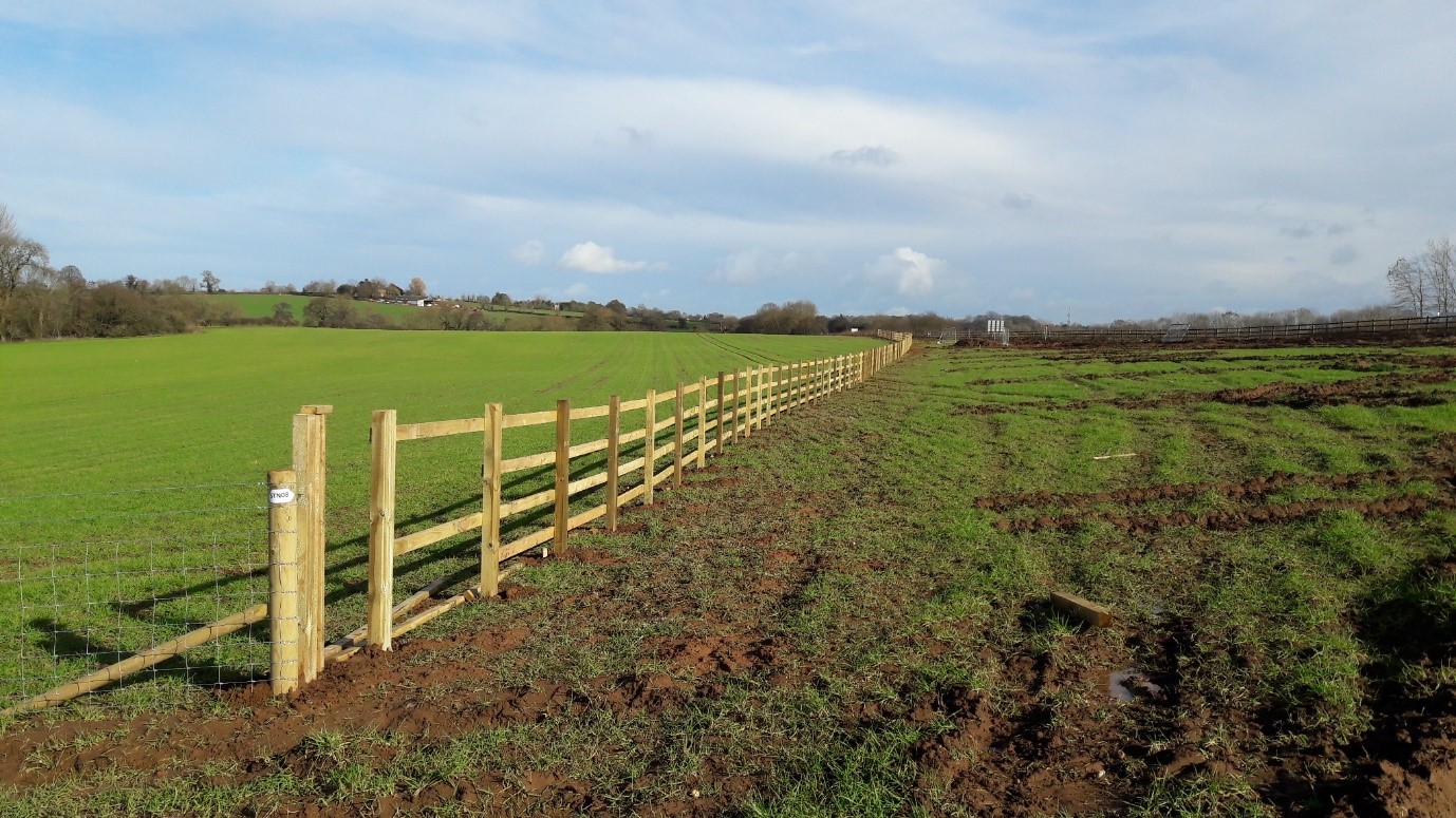 Erecting the new permanent boundary fence alongside the A46 northbound entry slip road