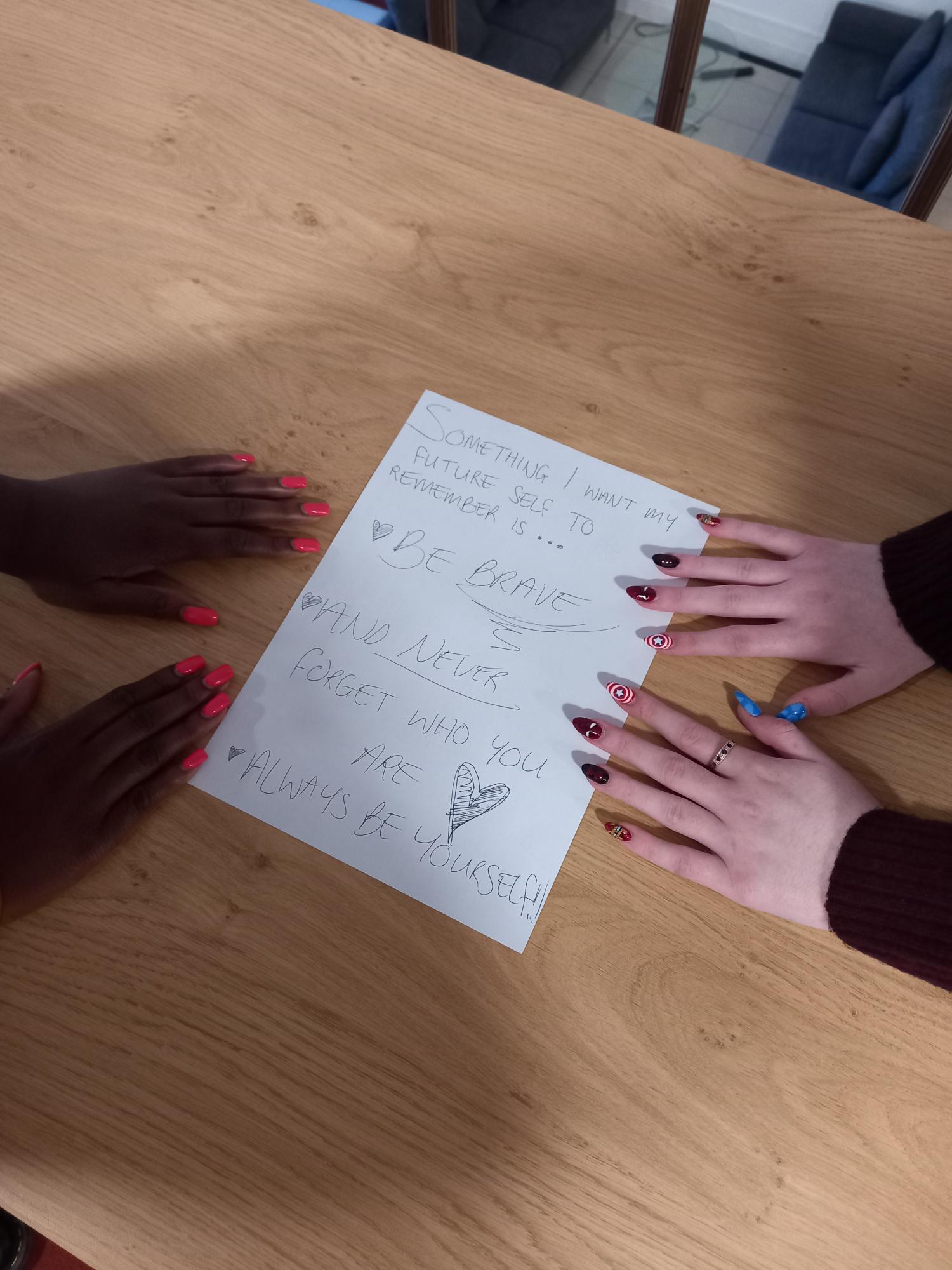Members of Warwickshire Youth Council write down messages for their future selves.